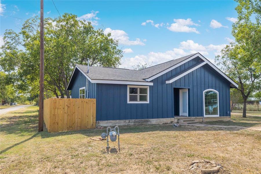View of front of property featuring a shingled roof and board and batten siding View of front of property featuring a shingled roof and board and batten siding