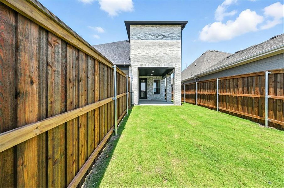 Front exterior of a new home in Talia, Mesquite, TX, highlighting curb appeal (Image 2).