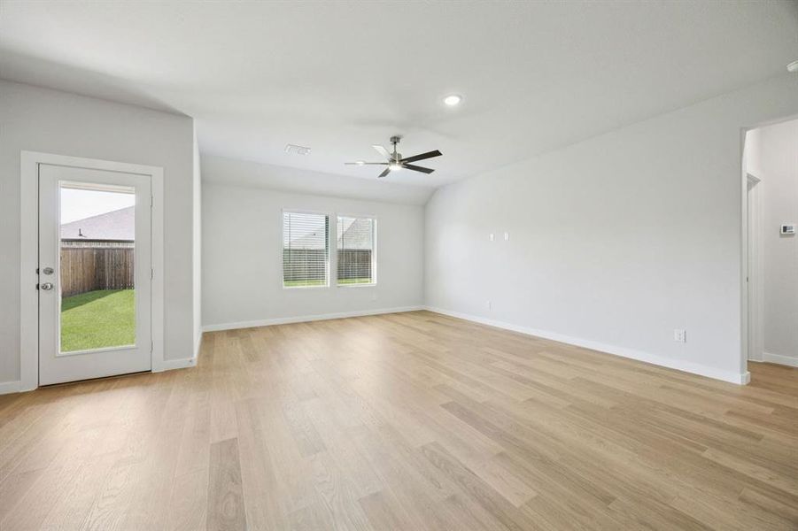 Living Room in the Heisman home plan by Trophy Signature Homes – REPRESENTATIVE PHOTO Living Room in the Heisman home plan by Trophy Signature Homes – REPRESENTATIVE PHOTO