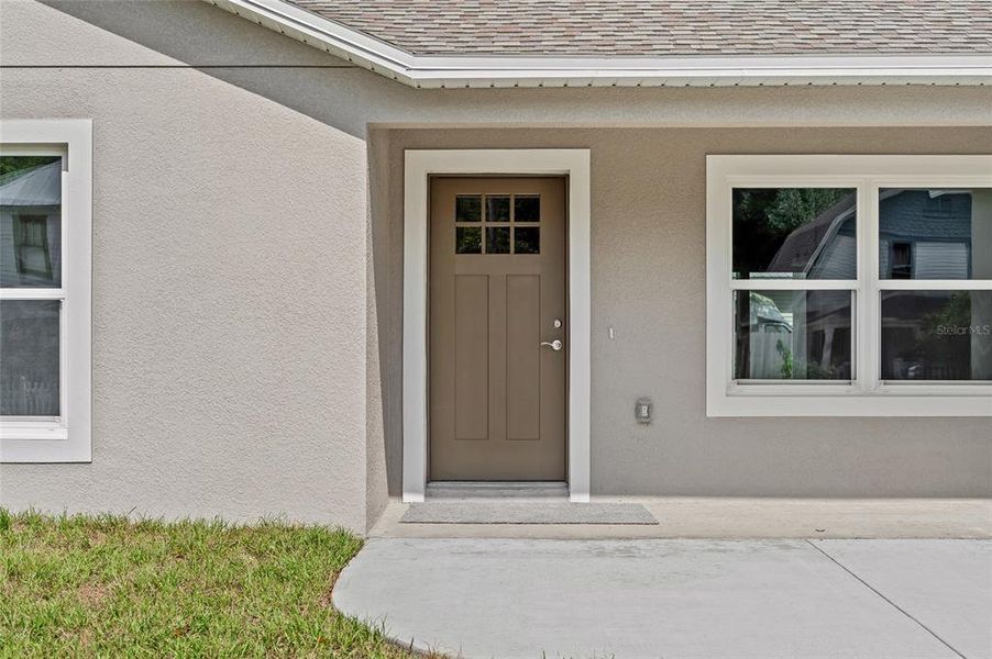 Front exterior of a new home in , Orange City, FL, highlighting curb appeal (Image 2).