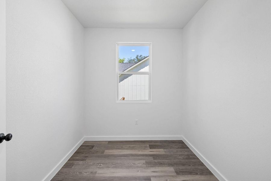 Minimalist space ready for customization, featuring a single window and durable flooring. Minimalist space ready for customization, featuring a single window and durable flooring.