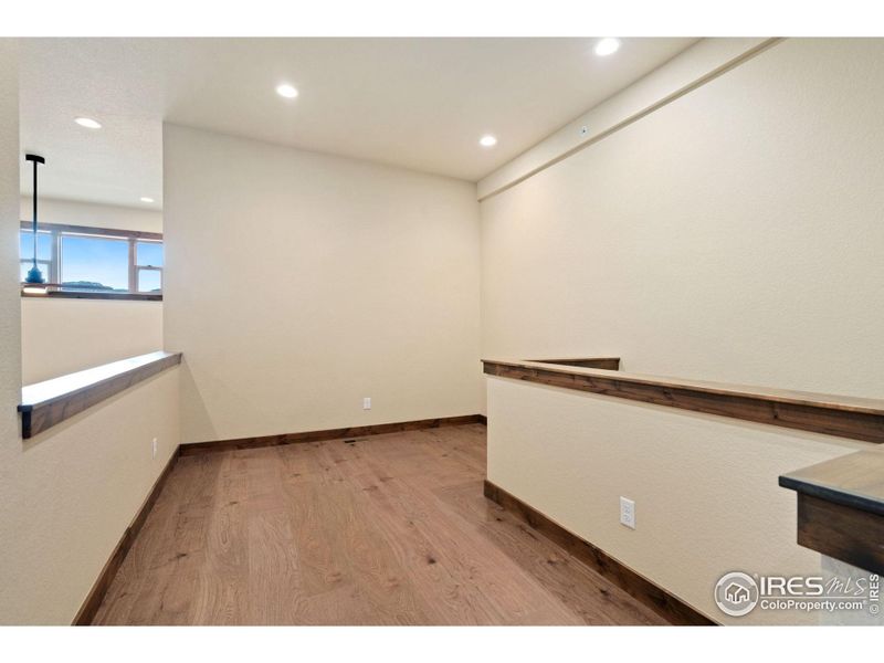 Upper level loft, ideal for an office space, art studio, or play area