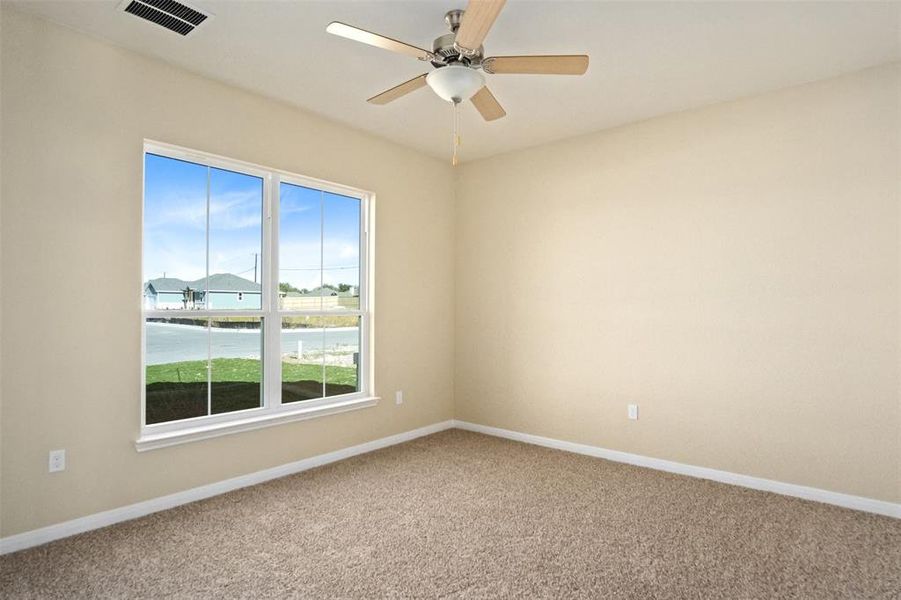 Primary bedroom with ceiling fan Primary bedroom with ceiling fan