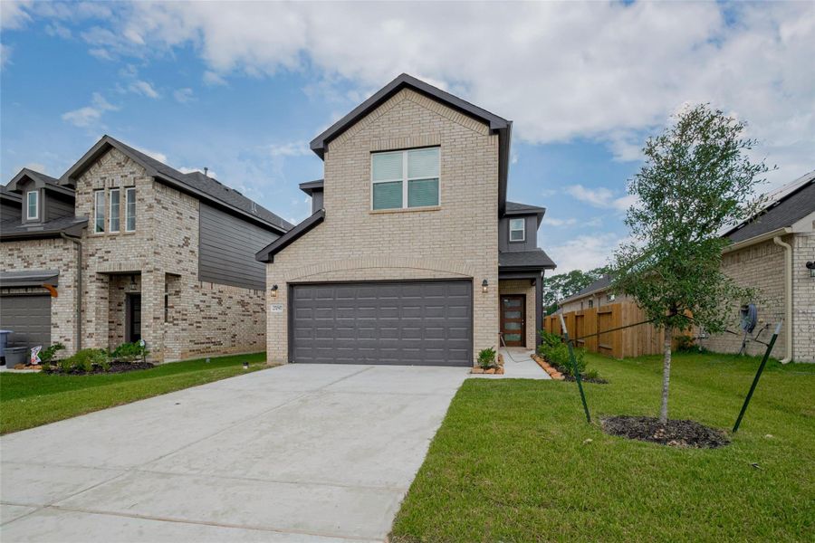 Front exterior of a new home in Mill Creek Trails, Magnolia, TX, highlighting curb appeal (Image 1). Front exterior of a new home in Mill Creek Trails, Magnolia, TX, highlighting curb appeal (Image 1).