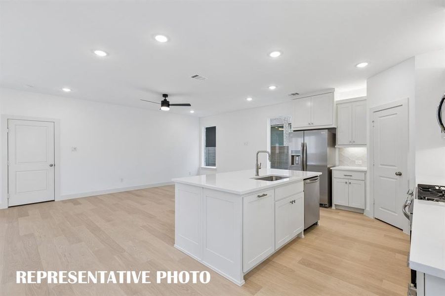 Featuring a wonderful open concept floor plan, the chef in the family will never be left out of the party in this outstanding home.  REPRESENTATIVE PHOTO