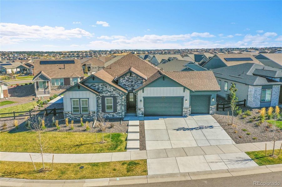 Front exterior of a new home in Hilltop at Inspiration, Aurora, CO, highlighting curb appeal (Image 1). Front exterior of a new home in Hilltop at Inspiration, Aurora, CO, highlighting curb appeal (Image 1).