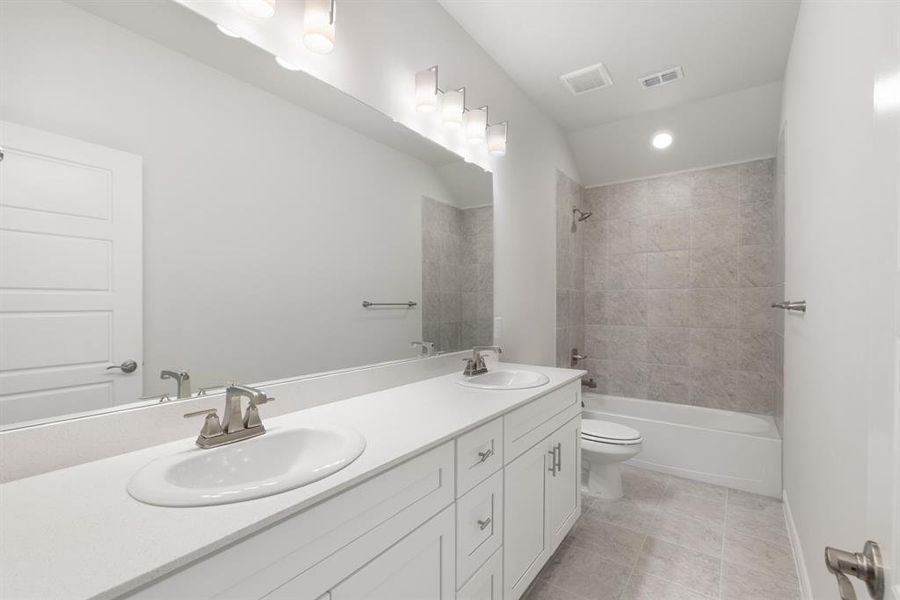 Guest will enjoy their own vanity space in this thoughtfully designed guest bath.