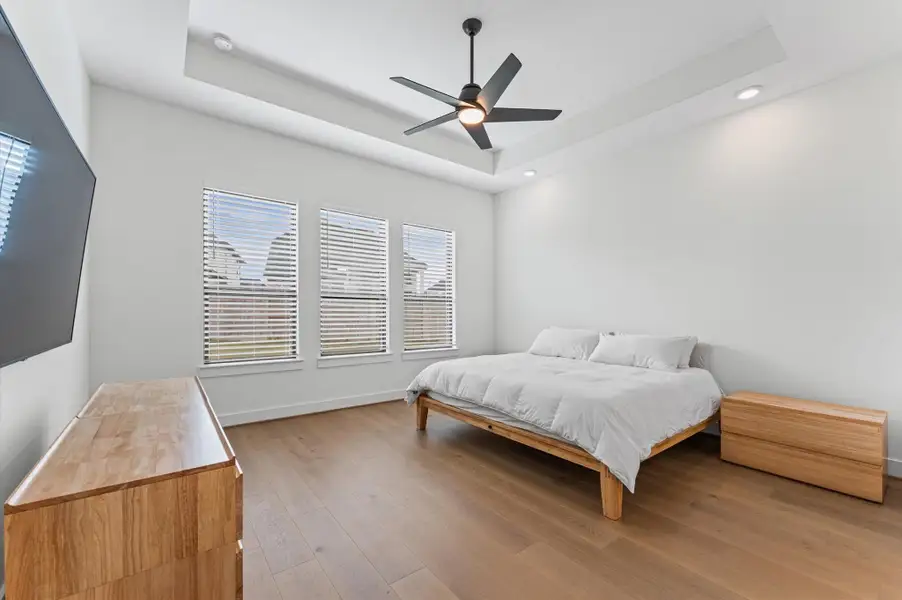 The primary bedroom offers the kind of space that actually lets you unwind.