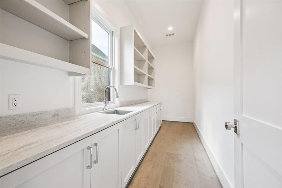 Walk in pantry with room for a second refrigerator offers a second sink, ample counterspace and storage. Walk in pantry with room for a second refrigerator offers a second sink, ample counterspace and storage.