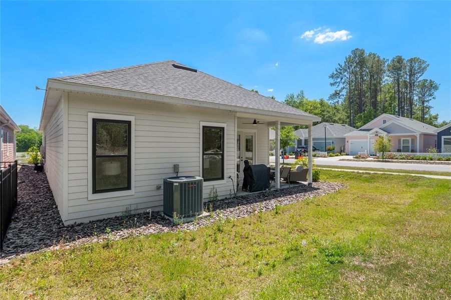 Exterior details and patio area of a home in Fairway Pointe at West End, Newberry (Image 31).
