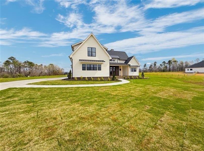 Front exterior of a new home in , Rydal, GA, highlighting curb appeal (Image 25).