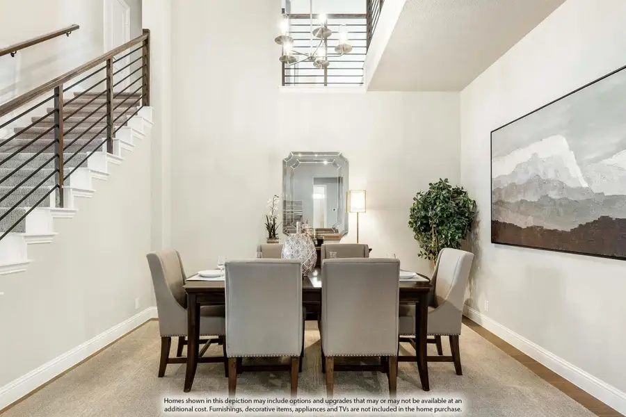 Formal dining room with two-story ceiling, dark wood table, six upholstered chairs, and modern chandelier near staircase.