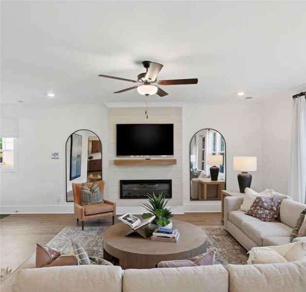A welcoming living area showcases light hardwood f A welcoming living area showcases light hardwood f