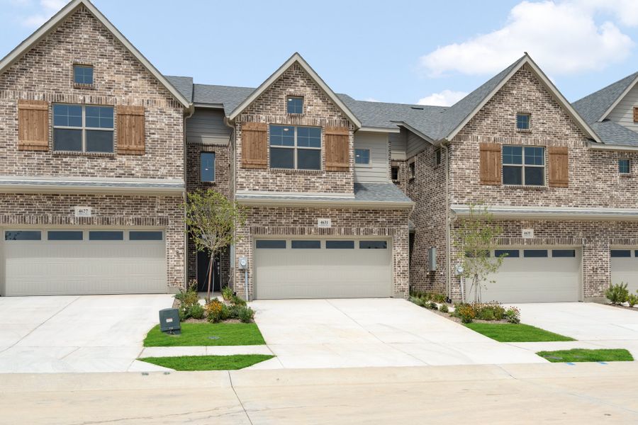 Front exterior of a new home in Wildridge, Oak Point, TX, highlighting curb appeal (Image 1). Front exterior of a new home in Wildridge, Oak Point, TX, highlighting curb appeal (Image 1).