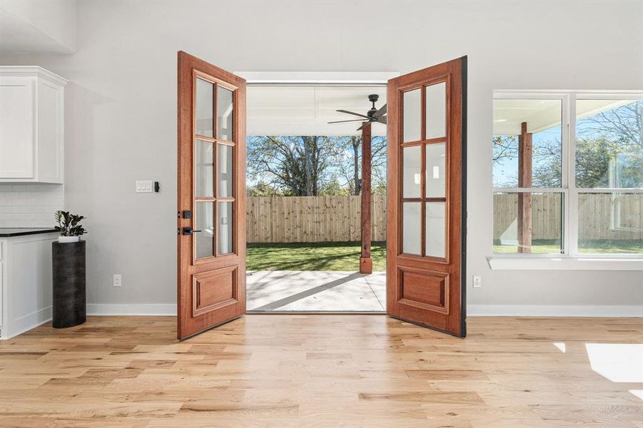 Foyer entrance featuring light wood-type flooring and ceiling fan