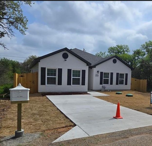 Single story home with fence, stucco siding, and roof with shingles Single story home with fence, stucco siding, and roof with shingles
