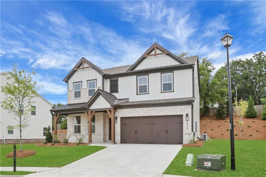 Front exterior of a new home in The Paddocks at Doc Hughes, Buford, GA, highlighting curb appeal (Image 25).
