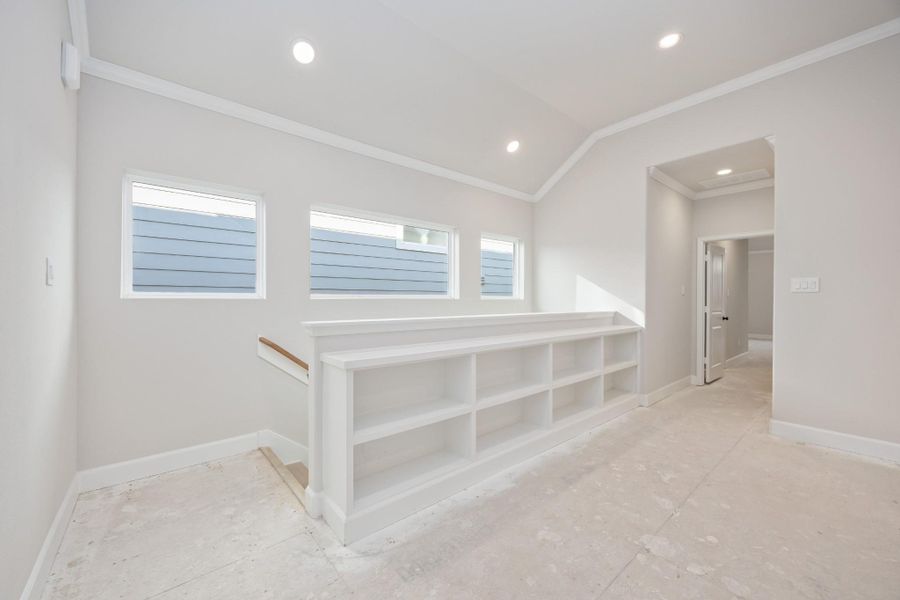 Sunlight streams through clerestory windows, casting the perfect glow on this stylish hallway landing. Bonus: built-in shelving that begs for your favorite reads and travel finds. Sunlight streams through clerestory windows, casting the perfect glow on this stylish hallway landing. Bonus: built-in shelving that begs for your favorite reads and travel finds.