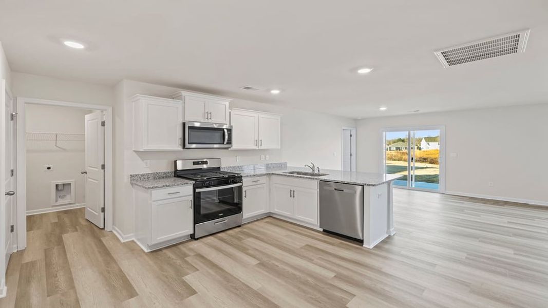 Furnished interior view inside a new home in Lakestone, Woodruff (Image 6).