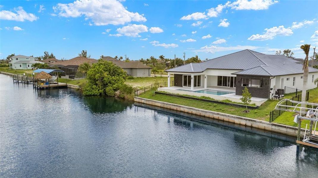 Front exterior of a new home in , Cape Coral, FL, highlighting curb appeal (Image 27). Front exterior of a new home in , Cape Coral, FL, highlighting curb appeal (Image 27).
