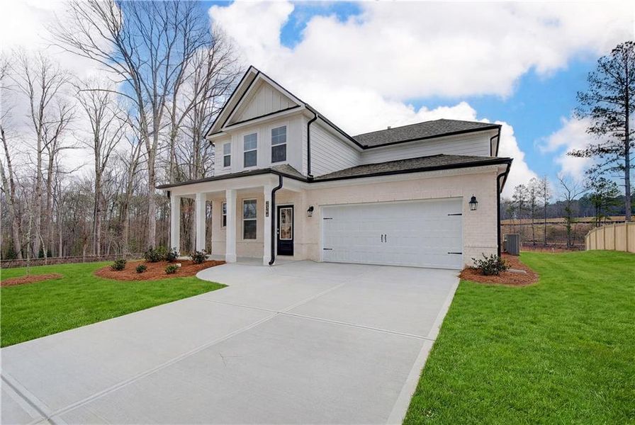 Front exterior of a new home in Hamilton Lakes, Lawrenceville, GA, highlighting curb appeal (Image 17).