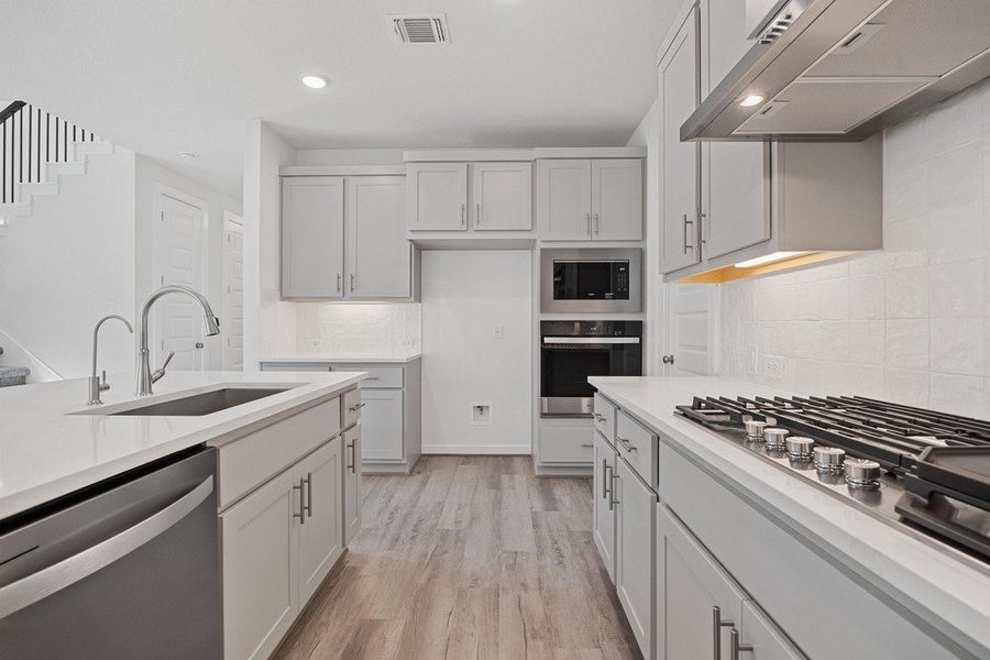Furnished interior view inside a new home in University Heights, Round Rock (Image 8).