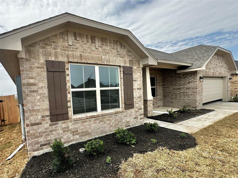 Front exterior of a new home in Cobblestone, Texas City, TX, highlighting curb appeal (Image 12). Front exterior of a new home in Cobblestone, Texas City, TX, highlighting curb appeal (Image 12).