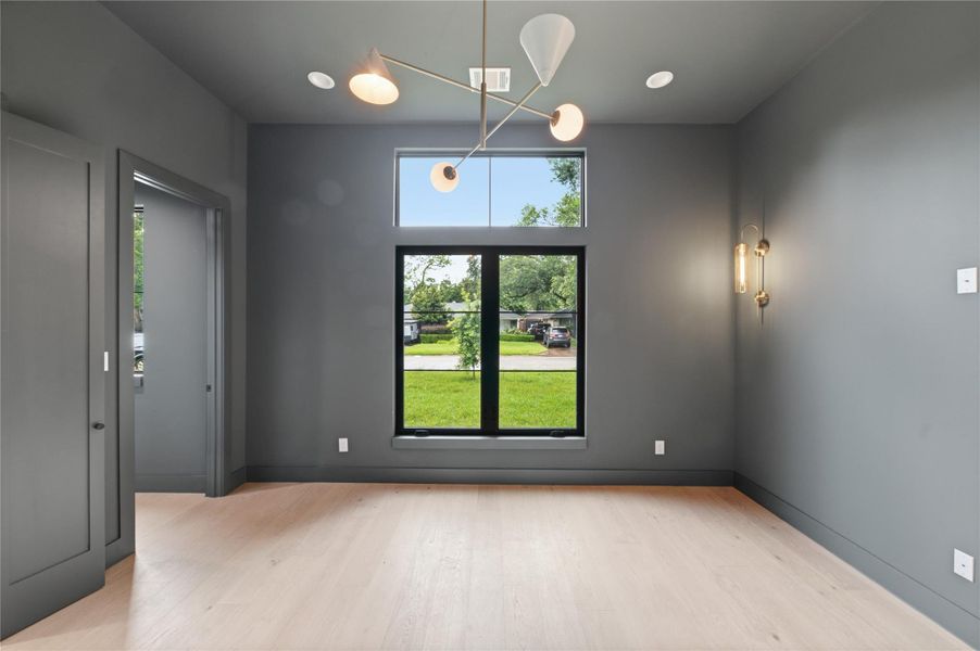 Create your perfect work-from-home setup in this sophisticated study filled with natural light and modern elegance.