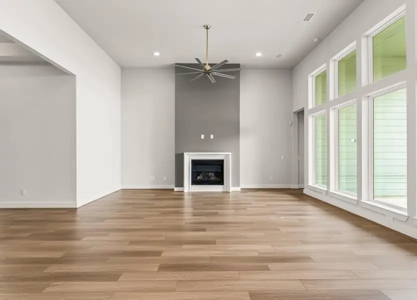 Great Room with 14ft. Ceiling, Tall Windows, Gas-Log Fireplace, and Fan. Great Room with 14ft. Ceiling, Tall Windows, Gas-Log Fireplace, and Fan.