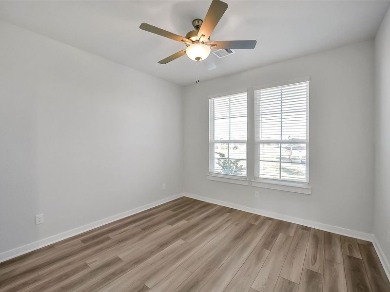 Spacious, unfurnished interior of a new home in Sunterra, Katy (Image 40).