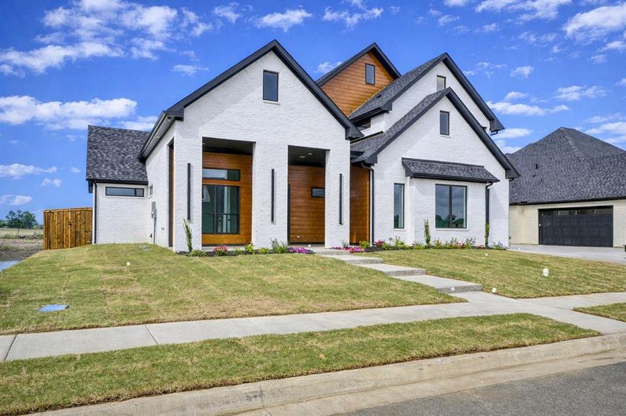 Front exterior of a new home in , Pottsboro, TX, highlighting curb appeal (Image 30).