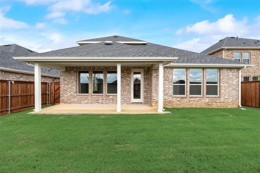 Exterior details and patio area of a home in Spiritas Ranch, Little Elm (Image 29). Exterior details and patio area of a home in Spiritas Ranch, Little Elm (Image 29).