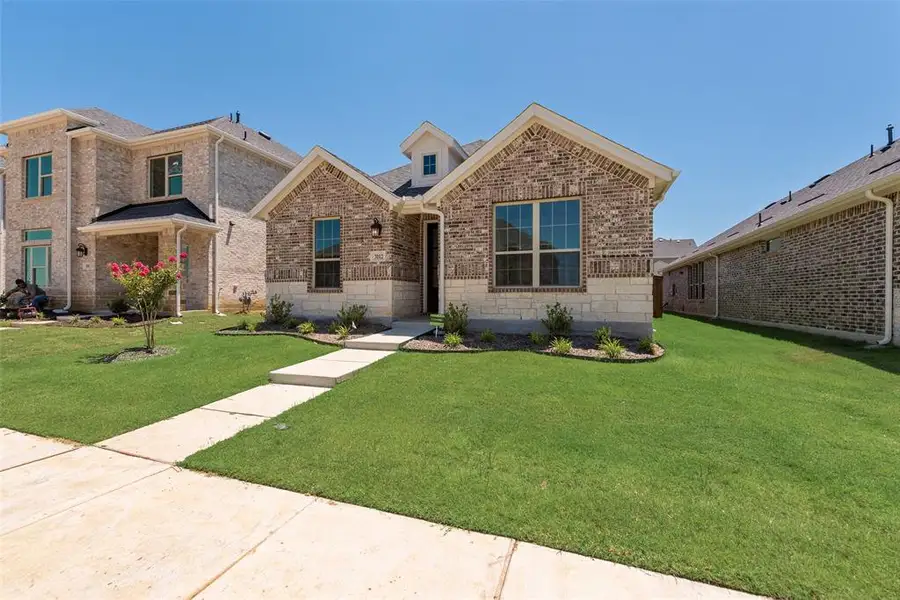 Front exterior of a new home in Arbors at Legacy Hills, Celina, TX, highlighting curb appeal (Image 15). Front exterior of a new home in Arbors at Legacy Hills, Celina, TX, highlighting curb appeal (Image 15).