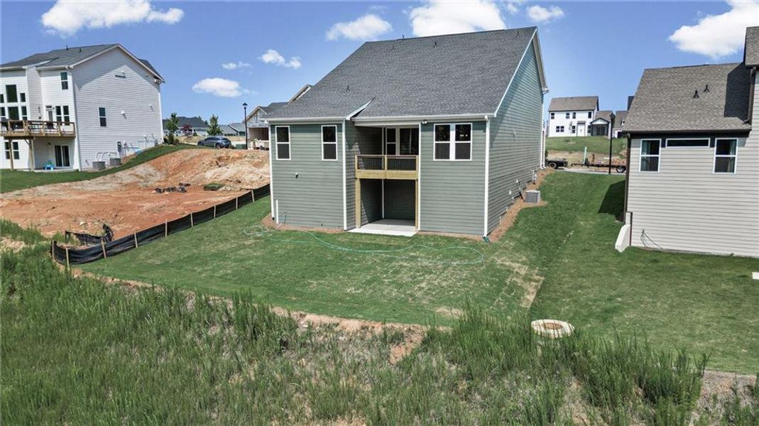 Exterior details and patio area of a home in Twin Lakes, Hoschton (Image 32).