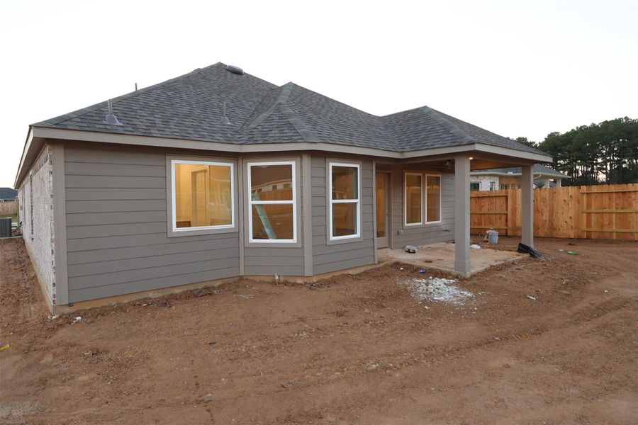 Front exterior of a new home in Sorella, Tomball, TX, highlighting curb appeal (Image 2).
