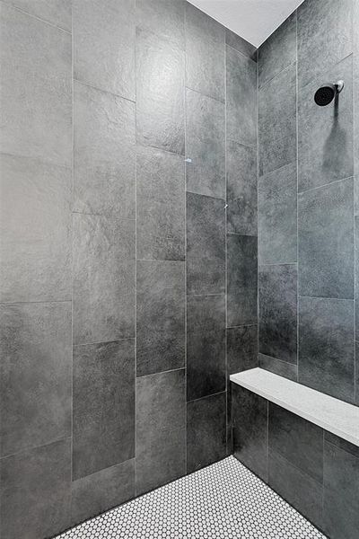 Interior details featuring a tile shower