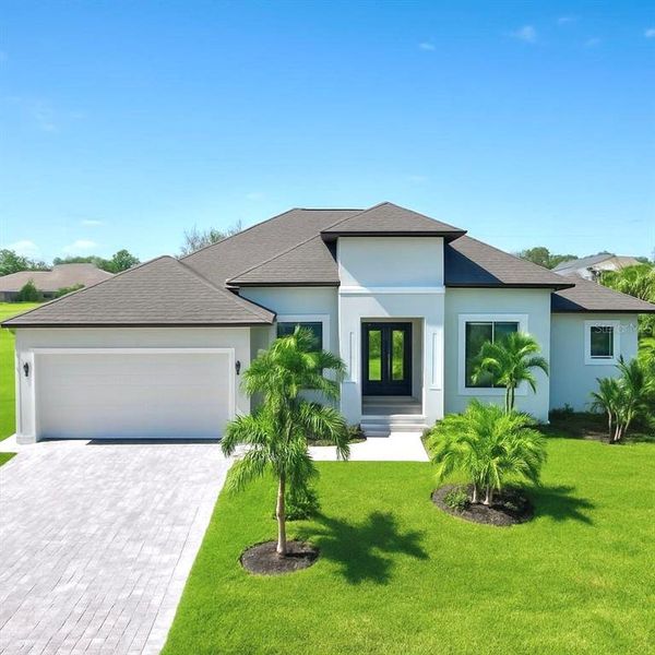 Front exterior of a new home in , Rotonda West, FL, highlighting curb appeal (Image 25).