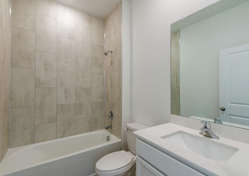 Spare bathroom with large countertop space and a soaker tub.