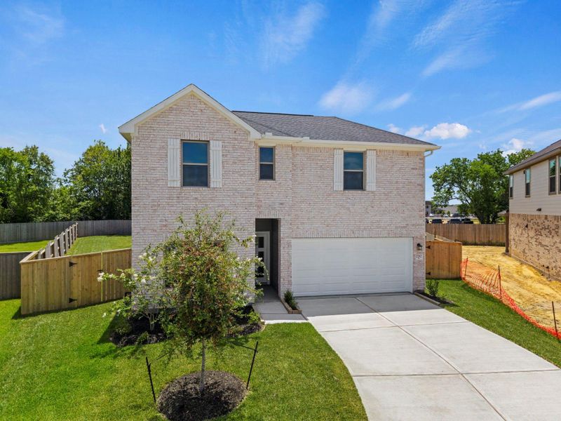 Front exterior of a new home in Laurel Landing, Alvin, TX, highlighting curb appeal (Image 21). Front exterior of a new home in Laurel Landing, Alvin, TX, highlighting curb appeal (Image 21).