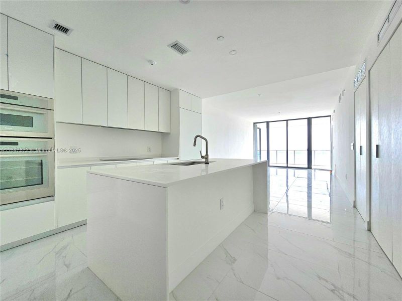 Furnished interior view inside a new home in Aria Reserve, Miami (Image 8).