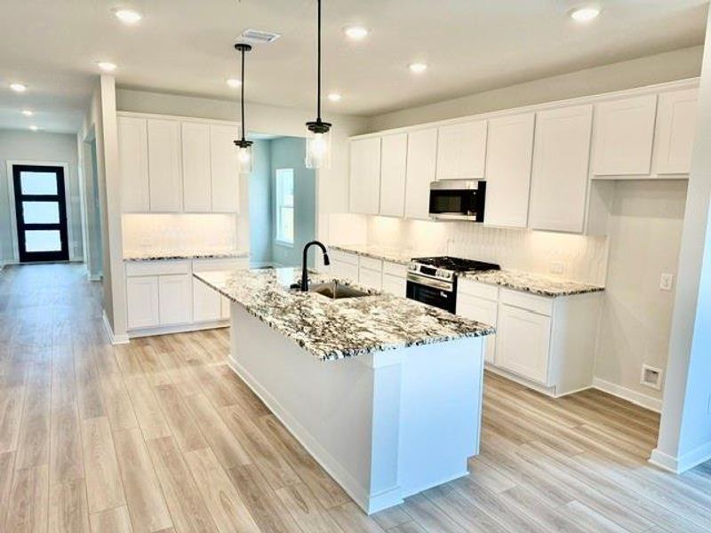 Furnished interior view inside a new home in Sundance Cove, Crosby (Image 3).