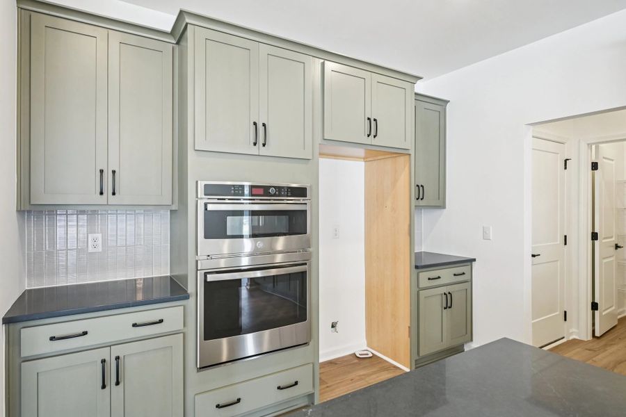 Kitchen featuring the AW Collection® Rosemary - Matte black, light wood, and garden-inspired style