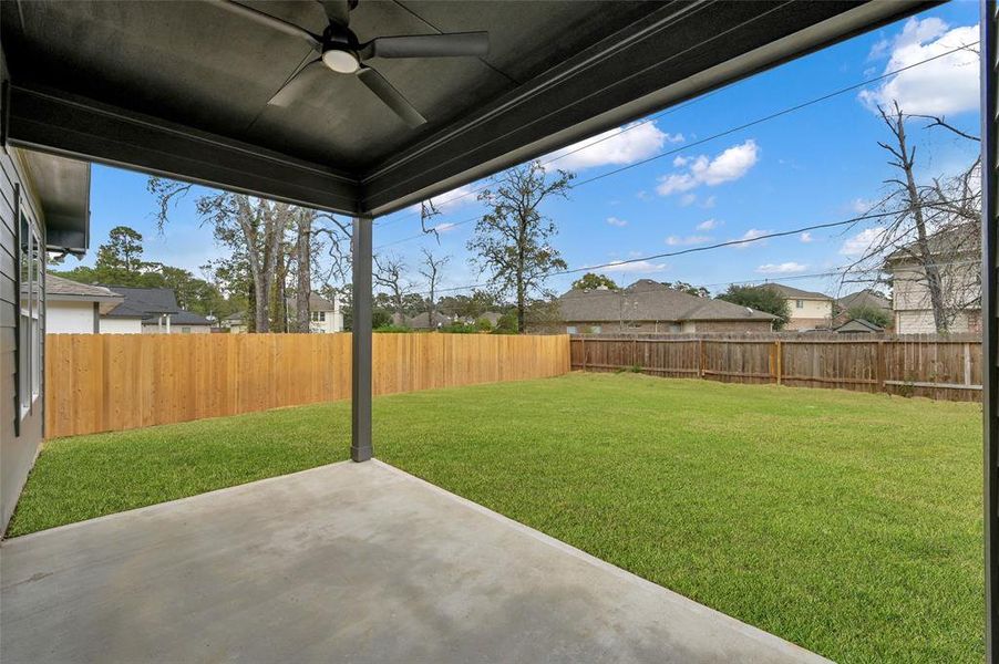 Covered patio with fan and gas connection.