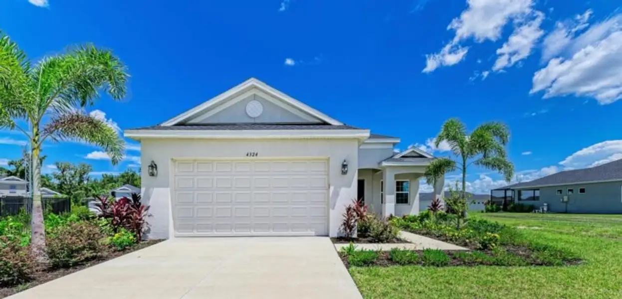 Front exterior of a new home in The Willows, Parrish, FL, highlighting curb appeal (Image 2). Front exterior of a new home in The Willows, Parrish, FL, highlighting curb appeal (Image 2).