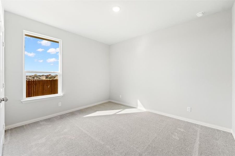 Empty room featuring carpet and recessed lighting