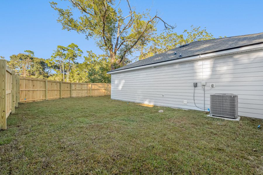 Exterior details and patio area of a home in Live Oak Cottages, Freeport (Image 29). Exterior details and patio area of a home in Live Oak Cottages, Freeport (Image 29).