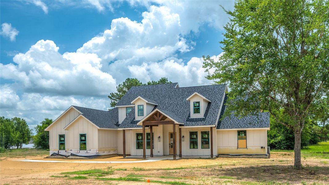 Front exterior of a new home in , Montgomery, TX, highlighting curb appeal (Image 25). Front exterior of a new home in , Montgomery, TX, highlighting curb appeal (Image 25).