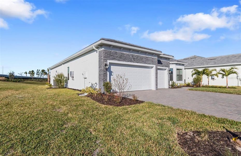 Front exterior of a new home in Del Webb Catalina, Lakewood Ranch, FL, highlighting curb appeal (Image 22).