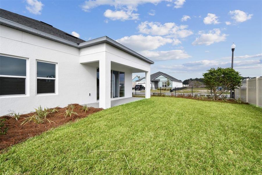 Exterior details and patio area of a home in Oakfield at Mount Dora Village Series, Mount Dora (Image 21).