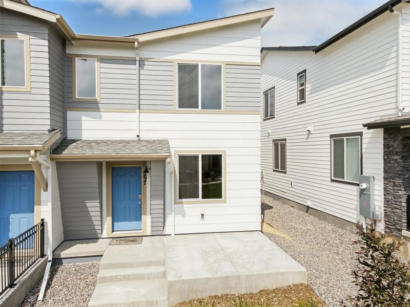 Front exterior of a new home in Pintail Commons at Johnstown Village, Johnstown, CO, highlighting curb appeal (Image 2).